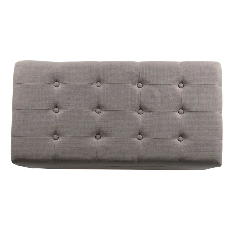 Banc de rangement gris capitonné